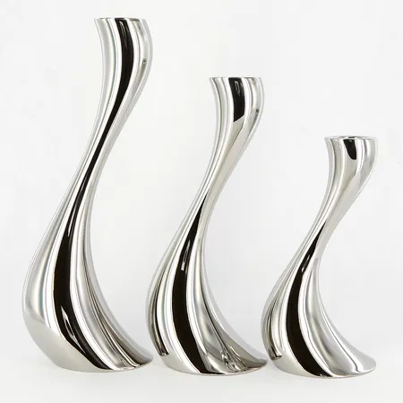Tre Ljusstakar Georg Jensen Cobra, Constantin Wortmann, höjd 16cm, 20cm samt 24cm, polerat rostfritt stål, en med fläck/märke, originalkartong