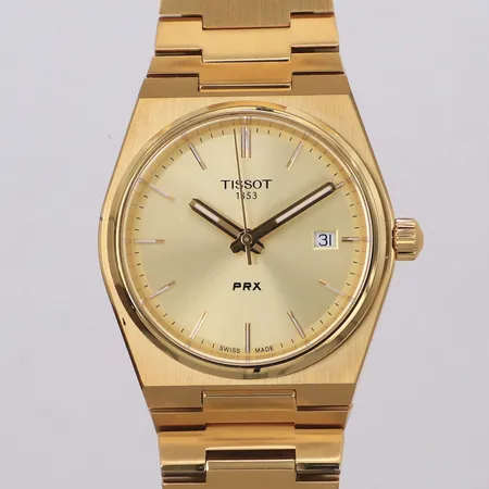 Armbandsur Tissot PRX, quartz, datum, Ø35mm, guldfärgat stål, Ø35mm, ref-nr T137.210.33.021.00, serie-nr M1V.8MD.P7V, en extra länkbit, cert, manual, box, ytterkartong