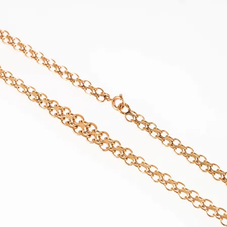 Collier X-länk i 14K guld. Det är 45,5 cm långt, 5,5 - 7,5 mm brett och väger 11,2g. Springring. 