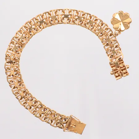 Armband X-länk med stav, längd 18,5cm bredd 10,3mm, berlock fyrklöver Ø13,5mm, gravyr, Ädelsmycken Aktiebolag, år 1961,18K Vikt: 26,4 g