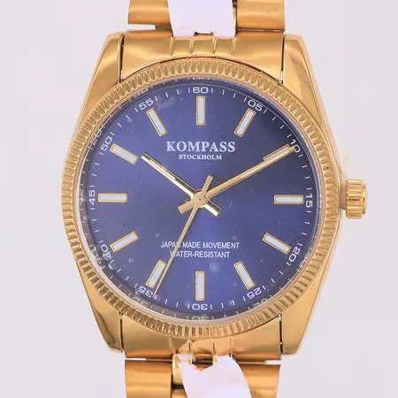 Herrur Kompass Stockholm quartz Ø36mm, guldfärgat stål, viklås ca 19cm, fint skick i tygetui, plasten kvar på framsida & baksida