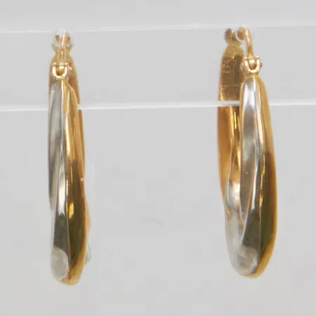 Ett par örhängen, creoler, längd 25mm, bredd 20,6mm, ihåliga, tvåfärgade, 18K Vikt: 2,1 g