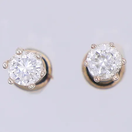 Ett par örhängen med vit sten, 5mm, metallstoppar ej med i vikt, saknar stämplar, silver Vikt: 0,6 g