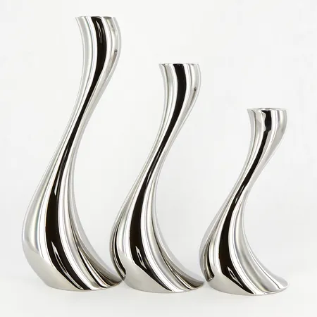 Tre Ljusstakar Georg Jensen Cobra, Constantin Wortmann, höjd 16cm, 20cm samt 24cm, polerat rostfritt stål, smärre bruksslitage, originalkartong