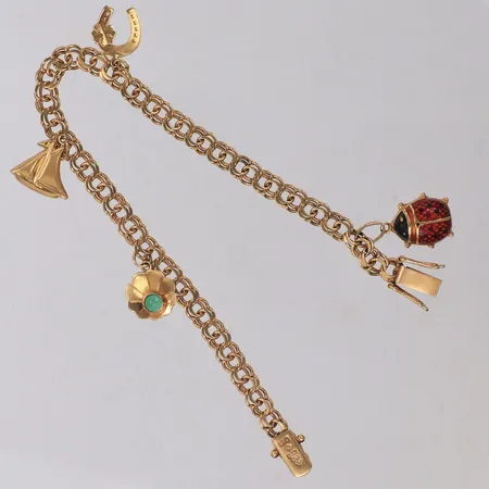 Armband med berlocker, längd 19cm, bredd 5,1mm, 18K Vikt: 12,4 g