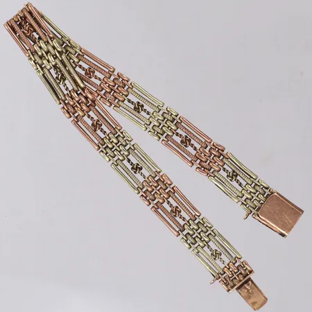 Armband, längd 19,5cm, bredd 10mm, tvåfärgad, säkerhetskedja saknas, 14K Vikt: 19,8 g