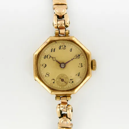 Damur, 14K i boett, manuell, ca 24mm, flexlänk i metall, bucklor, gravyr