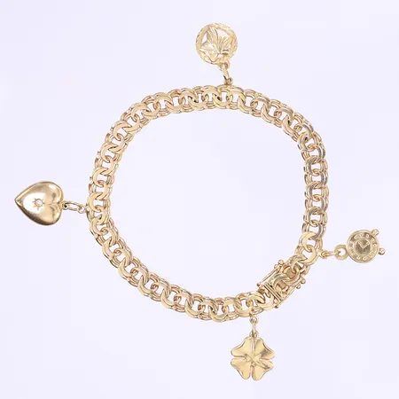 Armband Bismarck, med 4 berlocker varav en med liten pärla, längd 19cm, bredd 6mm, svenska stämplar 1965, 18K Vikt: 20,9 g