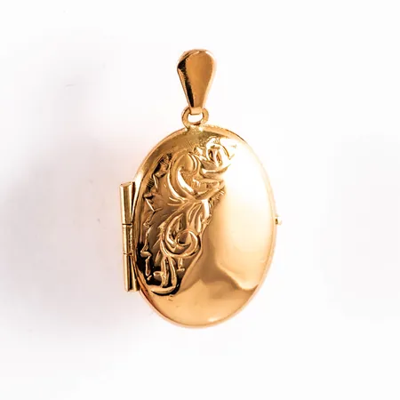 Hänge medaljong i 18K guld. Det är 16 mm brett, 28 mm långt inkl. ögla och väger 2,4g.