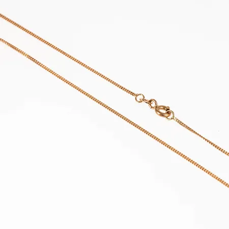 Kedja Pansar i 18K guld. Den är 38 cm lång, 1 mm bred och väger 1,8g. Fint skick. springring. 