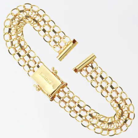 Klockarmband X-länk, längd 15cm, bredd 8mm, 18K. Vikt: 8 g