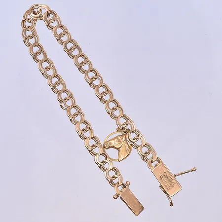 Armband Bismarck med en berlock, längd 19 cm, bredd 6 mm, en länk defekt, 18K. Vikt: 11,4 g