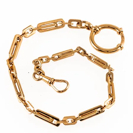 Klockkedja i 18K guld. Den är 27 cm lång, 5,5 mm bred och väger 23,2g. Fint skick.