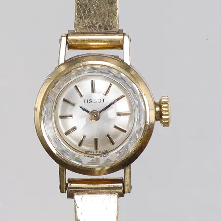 Damur Tissot Ø17mm manuell uppdragning, guld på stål, guldfärgad stållänk, ca 1960-tal, längd 16,5cm 