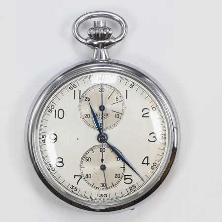 Fickur Heuer Militär med Kronograf Ø50mm Kronmärkt ÖVG 27, boett nr. 6844, snr. 602402, omkring 1900-talets mitt, stål, blånerade visare, urtavla med små fläckar
