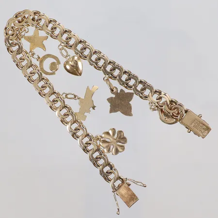 Armband Bismarck med sju Berlocker 19,5cm bredd 7mm 18K Vikt: 23,8 g