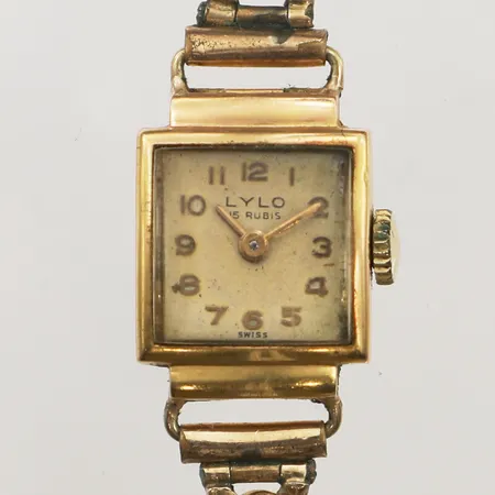 Damur Lylo 18K, manuell, 16x16mm, boettnr 81167, defekt, fungerar ej, bucklig boett stänger ej, slitet stålarmband, inga tillbehör.