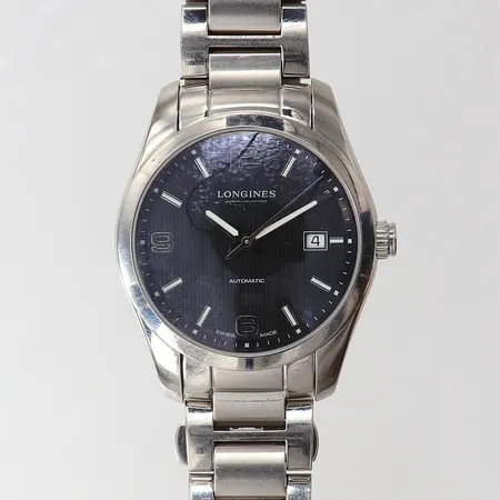 Herrur Longines Conquest Classic, automat, stål, stållänk, svart urtavla, datum, glas baksida, ref-nr: L2.285.4.56.6, serie-nr: 43760277, tre extra länkbitar, box, bruksslitage/repor, inga övriga tillbehör.