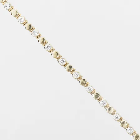 Armband med vita stenar, längd: 19,5 cm, bredd: 5 mm, glapp i lås, 14K guld. Vikt: 11 g
