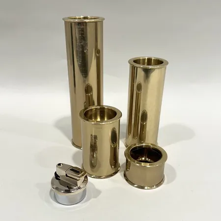Ljusstakar, fyra stycken, Cylinder 2000, Staffan Englesson, höjd 3cm, 8cm, 13cm, 18,5cm, mässing, lätt ytslitage, något repiga, tändare samt förpackning medföljer Skickas med paket.