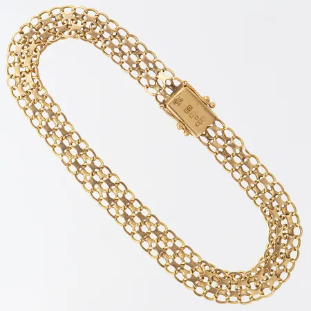 Armband X-länk, längd 20cm, bredd 8mm, 18K.  Vikt: 10,7 g