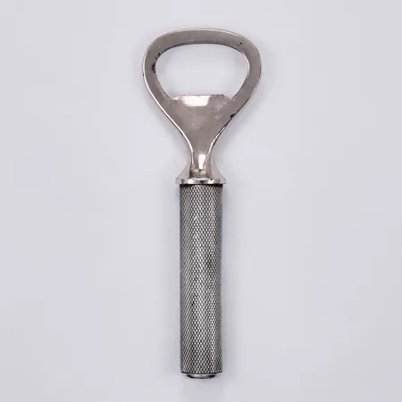 Kapsylöppnare i silver med svensk importstämpel, del i rostfritt stål samt fyllt skaft, 835/100 silver, bruttovikt: 72gram Vikt: 72 g