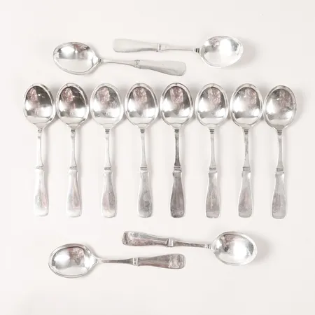 Tolv dessertskedar, modell Uppsala, MGAB, Lidköping, längd 15,5cm, slitage.  Vikt: 377,3 g