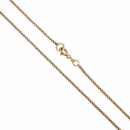 Kedja Venezia i förgyllt silver (925/1000). Den är 60 cm lång, 1,2 mm bred och väger 5,9g. Springring. Svag förgyllning.