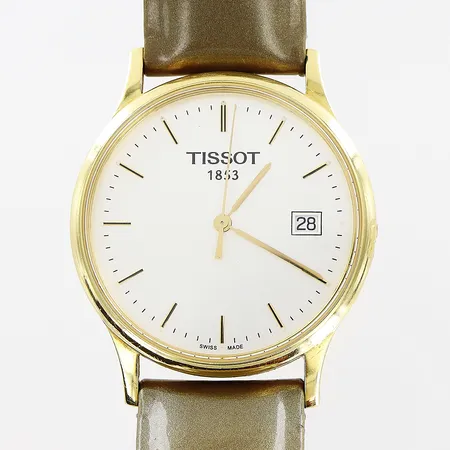 Herrur Tissot 18K, quartz, Ø33mm, datum, sekundvisare, uppdragsskruv saknas, läderband 22,5cm, original törnlås, gravyr, bruttovikt 32,9g, inga tillbehör.