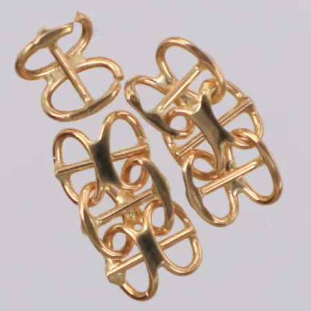 Guldbitar, delar av x-länk, 18K  Vikt: 0,9 g