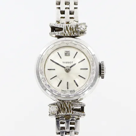 Damur Tissot vitguld 18K med diamanter, manuell, Ø15mm, diamanter 2 x ca 0,03ct, briljantslipade, korridorlänk 16,5cm, bruttovikt 24,3g, inga tillbehör.