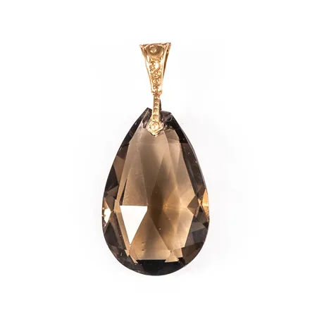 Hänge i 18K guld med droppformad brun sten/glas. Det är 12 mm brett, 25 mm långt inkl. ögla och väger 2,3g. Sliten spetsögla, flisa borta från sten.