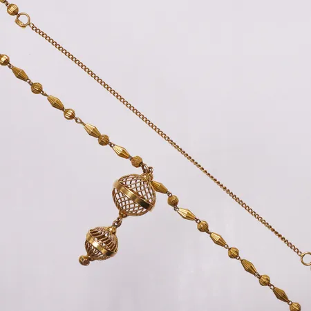 Collier ca 70cm, hängdel 55mm, utan lås, träs över huvudet, 21K  Vikt: 32,2 g