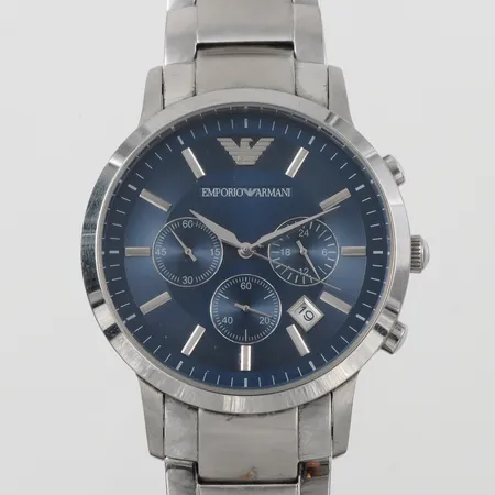 Herrur Emporio Armani diameter ca 42.6 mm,tickar igång men ej funktionstestad,box.