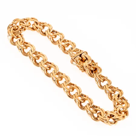 Armband Bismarck i 18K guld. Det är 18 cm långt, 8,5 mm brett och väger 25,1g. Kistlås. Stämplad K10 (1984), BJA (Bengt J Anderssons Guld, Stockholm), 18K. kattfot. 