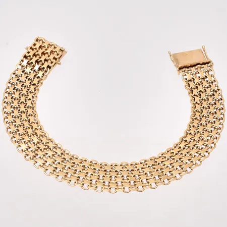 Armband i 18K guld, 20cm, X-länk, bredd 14mm, tillverkad av Hallberg Guldvarufabrik Aktiebolag, år 1964, vikt 27,28g.