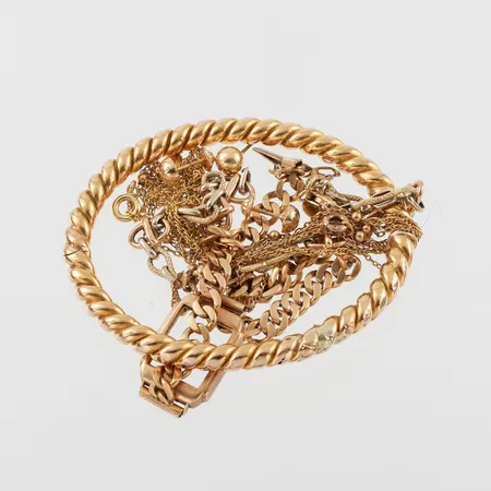 Trasigt guld 18k. Vikt: 39,5 g