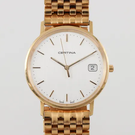 Herrur Certina 18k,tickar igång men ej funktionstestad,diameter ca 33.5 mm,gravyr,armband i gulmetall.