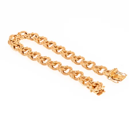 Armband bismarck i 18K guld. Det är 22 cm långt, 10 mm brett och väger 37,1g. Kistlås. Från JoAns Guld i Valskog. 
