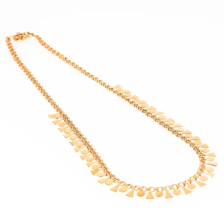 Collier bismarck i 18K guld med olikformade kläppar. Den är 42 cm lång, 3,5 - 9 mm bred och väger 15,0g. Kistlås. En länk vid låset är av och behöver lödas.