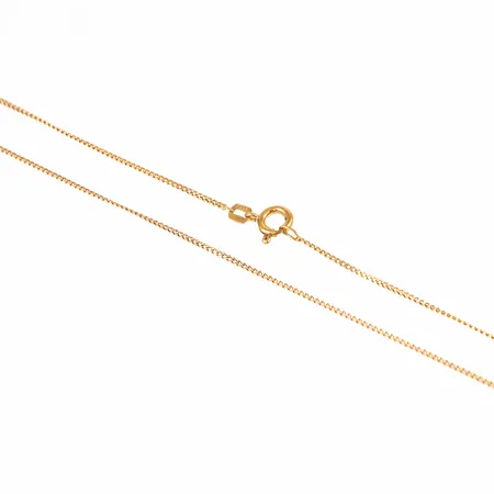 Kedja pansar i 18K guld. Den är 46 cm lång, 1,1 mm bred och väger 2,0g. 