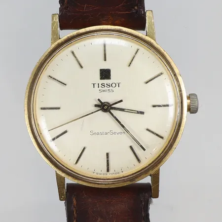 Herrur Tissot Seastar Seven 18K Ø33,5mm, manuell, defekt krona, går ej ställa tid/dra upp) med gravyr, monocoque-boett, defekt läderband bruttovikt 