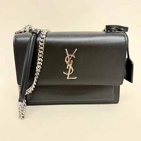 Handväska, Yves Saint Laurent, Sunset, medium, svart kalvskinn, mockafoder, nyckelring, axelkedja och YSL-logo i vitmetall, mått 15,5x22x6 cm, etikettkuvert, dustbag, originalkartong med skador