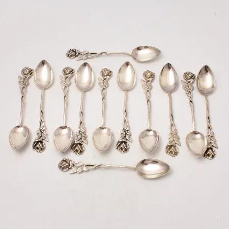 12st skedar i silver,11cm, modell Rosen, 830/1000, tillverkad av Gewe, vikt 143,67g.