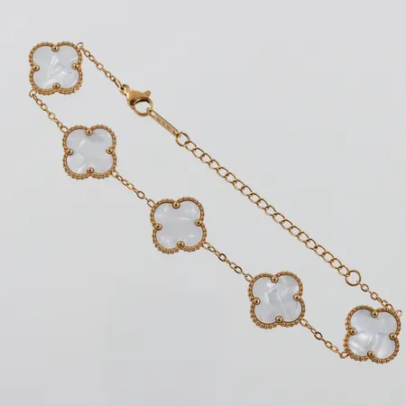 Armband 18k med pärlemo,längd ca 23 cm,bredd 14.5 mm. Ej märkesdesign Vikt: 8,2 g