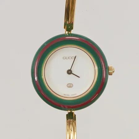 Damur Gucci, 25mm, quartz, 13 utbytbara färgringar, refnr:11/12, serienr:0785081, mycket fint skick, box, certifikat från 91, behov av batteribyte.