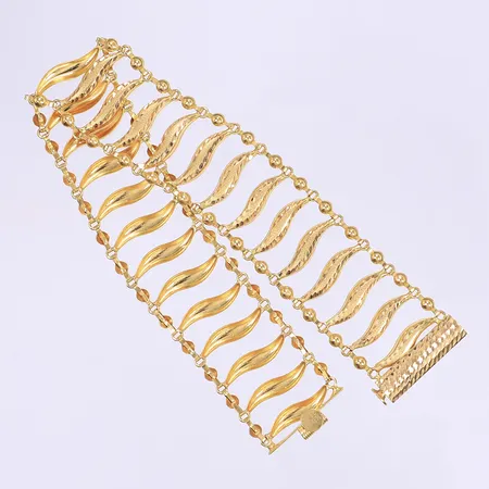 Armband öppningsbart längd 20cm bredd 20mm 21K Vikt: 17,5 g