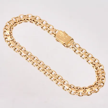 Armband i 18K guld, 19cm, X-länk, bredd 6,4mm, otydliga stämplar, vikt 11,6g.