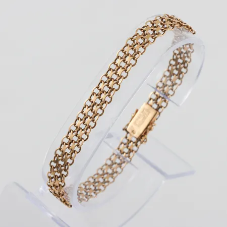 Armband 18k X-länk,längd ca 19 cm,bredd 7.5 mm,bruksslitage. Vikt: 10 g