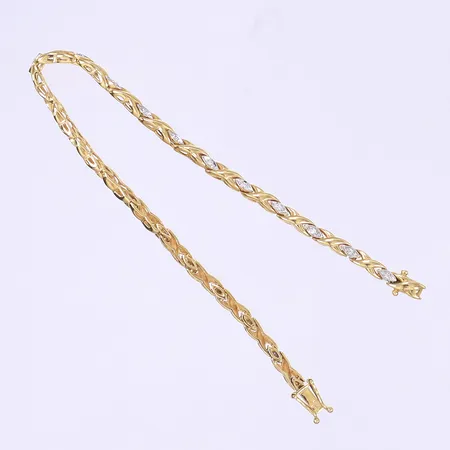 Armband med diamanter 21 x ca 0,01ctv GHA kistlås längd 18cm bredd 3mm 18K  Vikt: 9 g